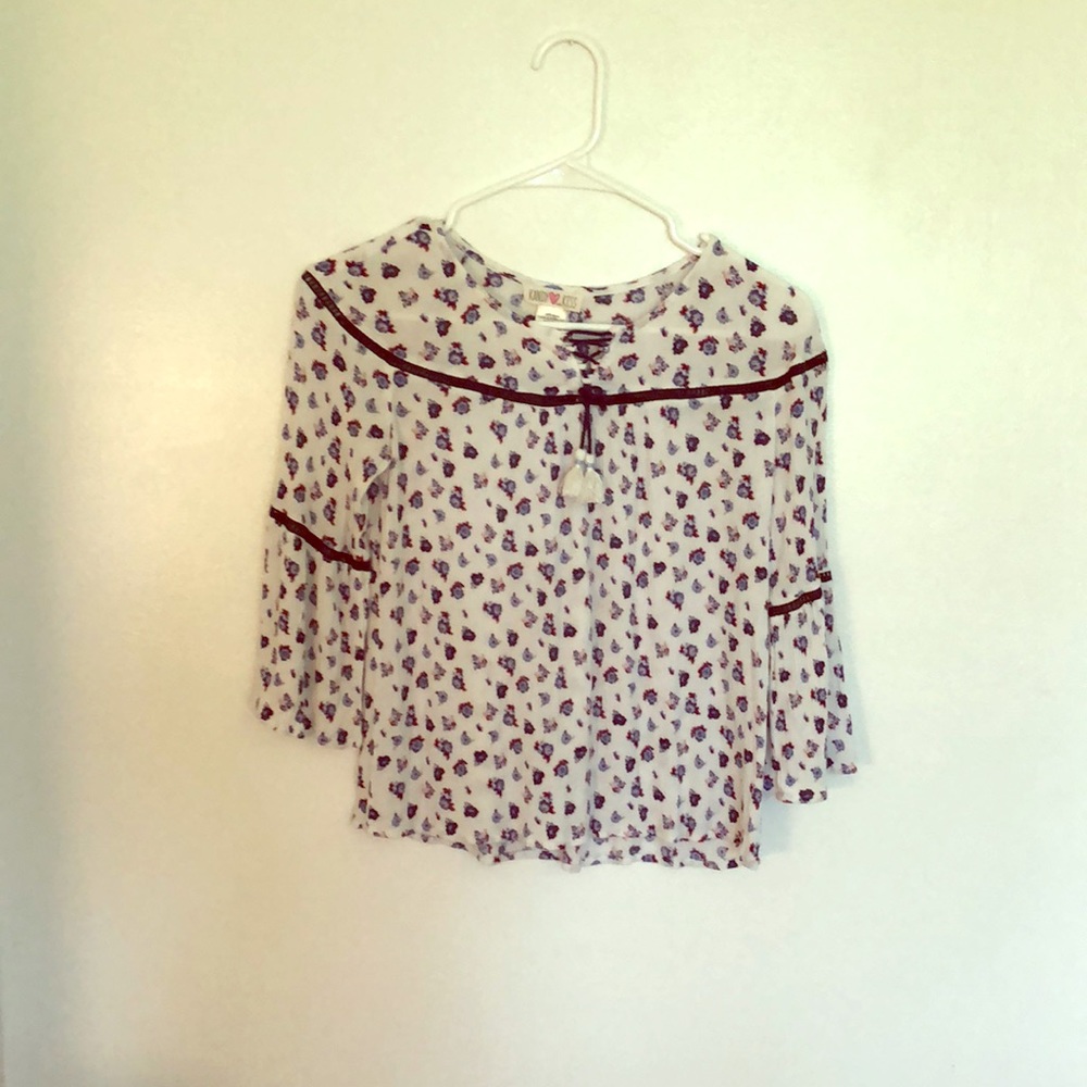 A long sleeve shirt that has flower designs